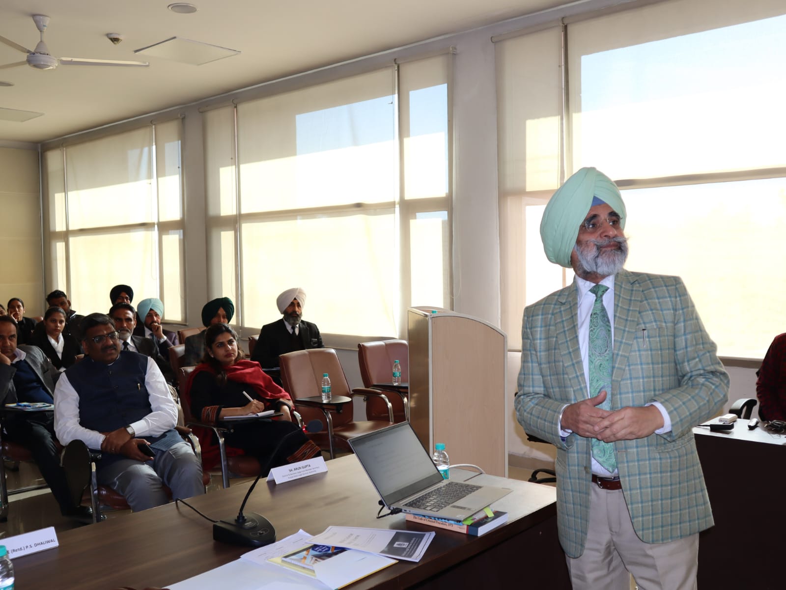 Hon'ble Mr. Justice (Retd.) P.S. Dhaliwal addressing the participants during the Training Programme organised for newly selected Legal Aid Defence Counsels
